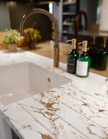 Marble sink with gold tap